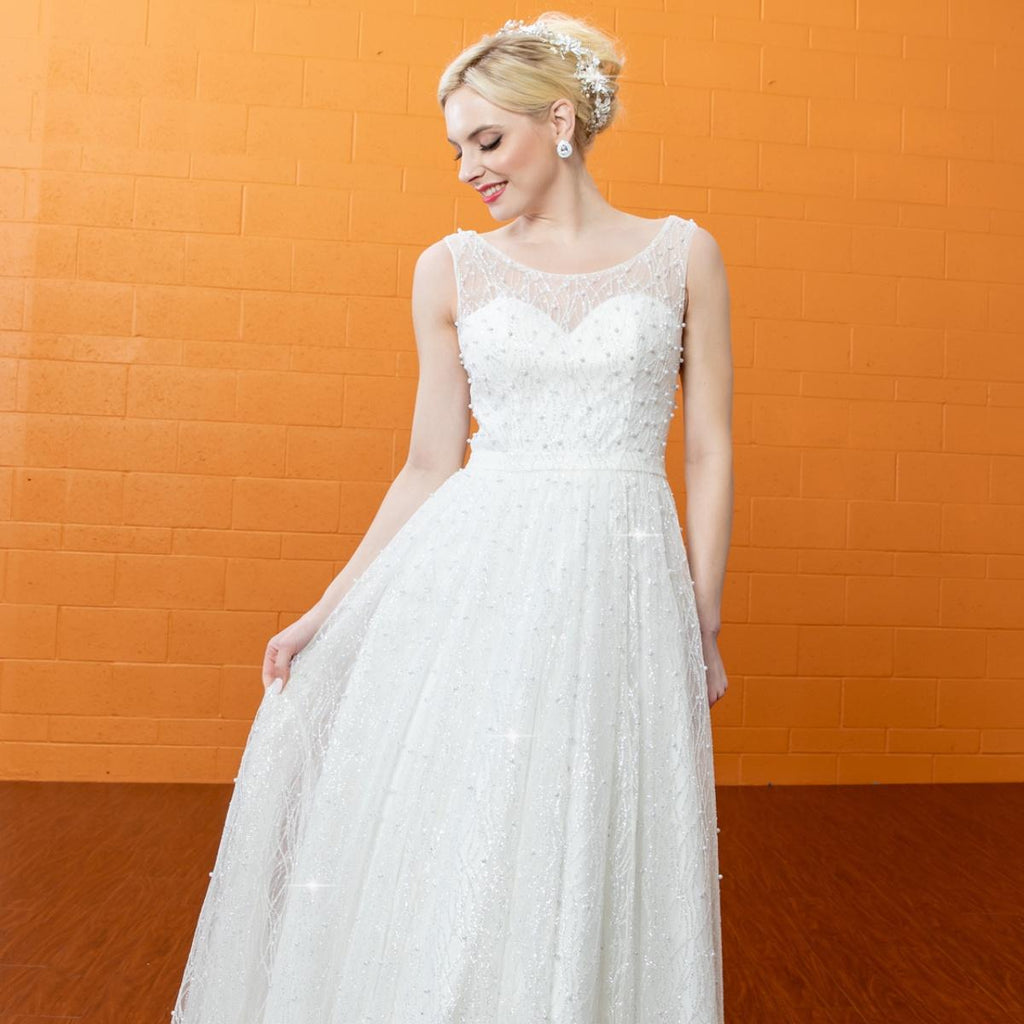 Gowns shine, lace details, light up occasions.