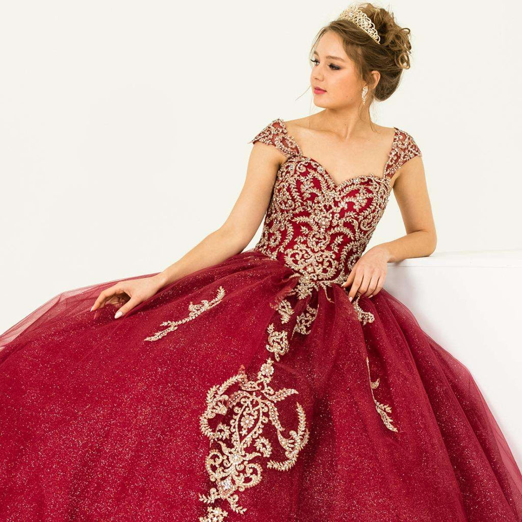 A beautiful gown, off-shoulder, reveals noble air.