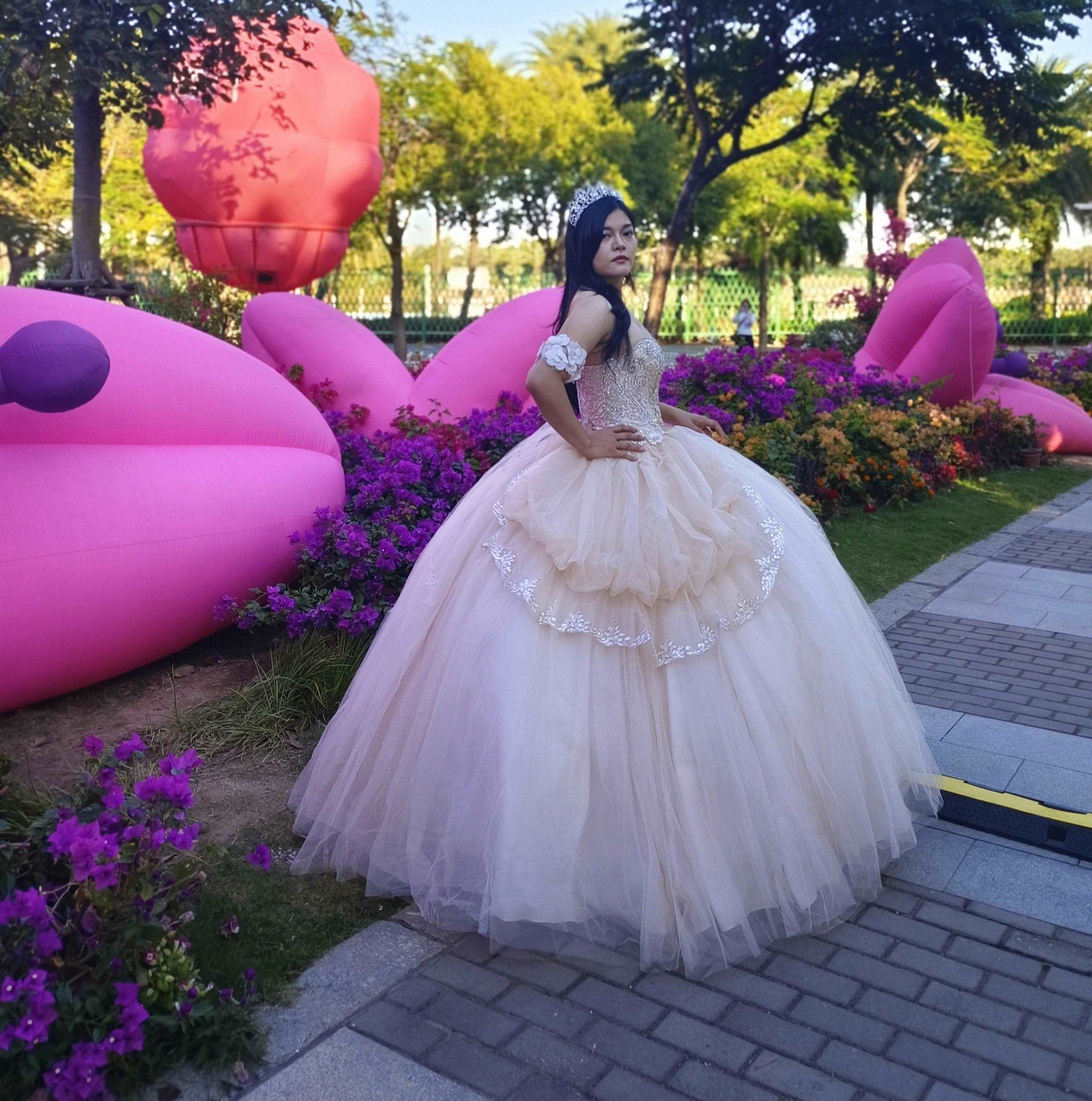 Adults in gowns, flowing skirts, confident display.