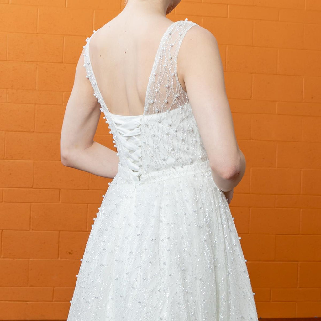 Gowns shine, lace details, light up occasions.