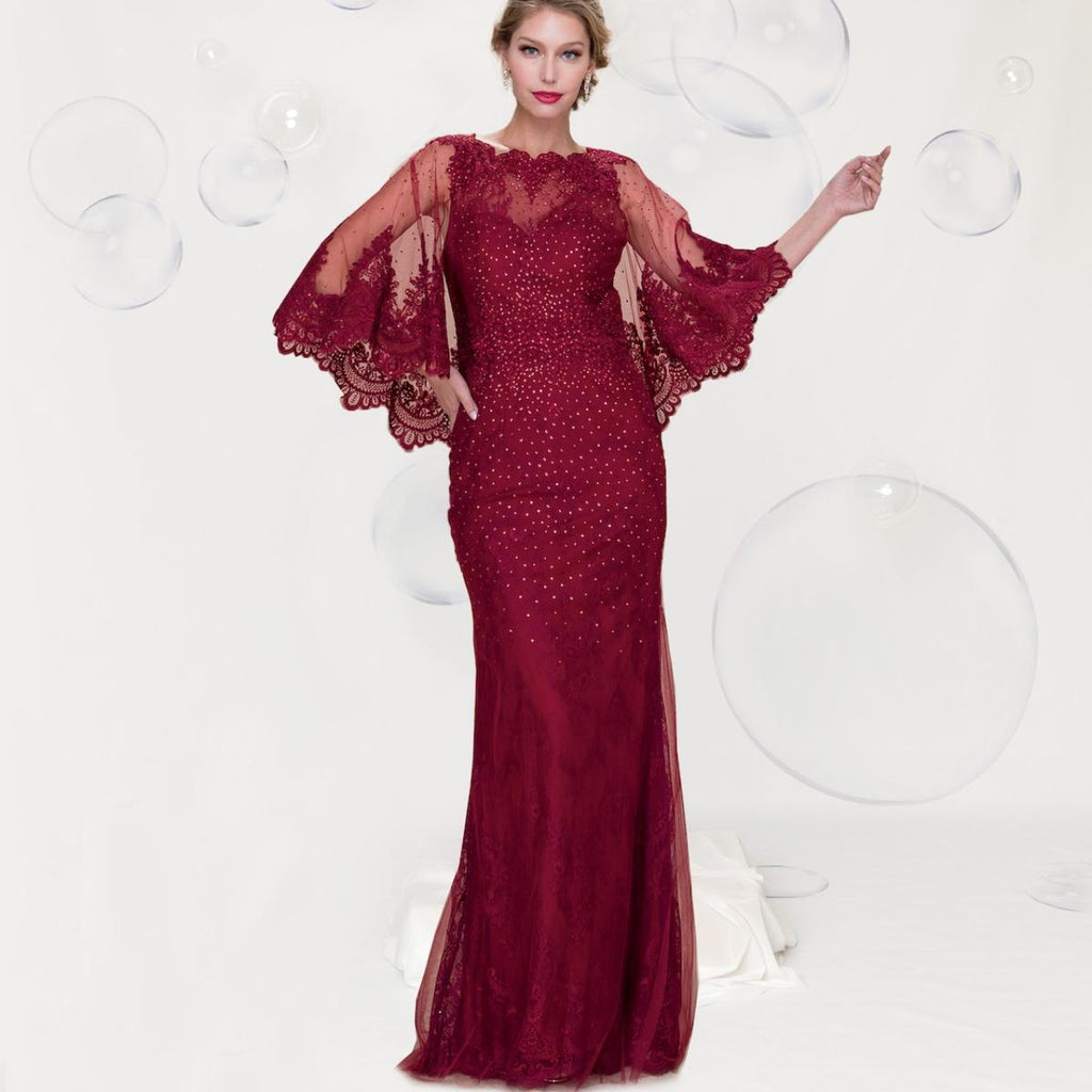 A beautiful gown, off-shoulder, reveals noble air.