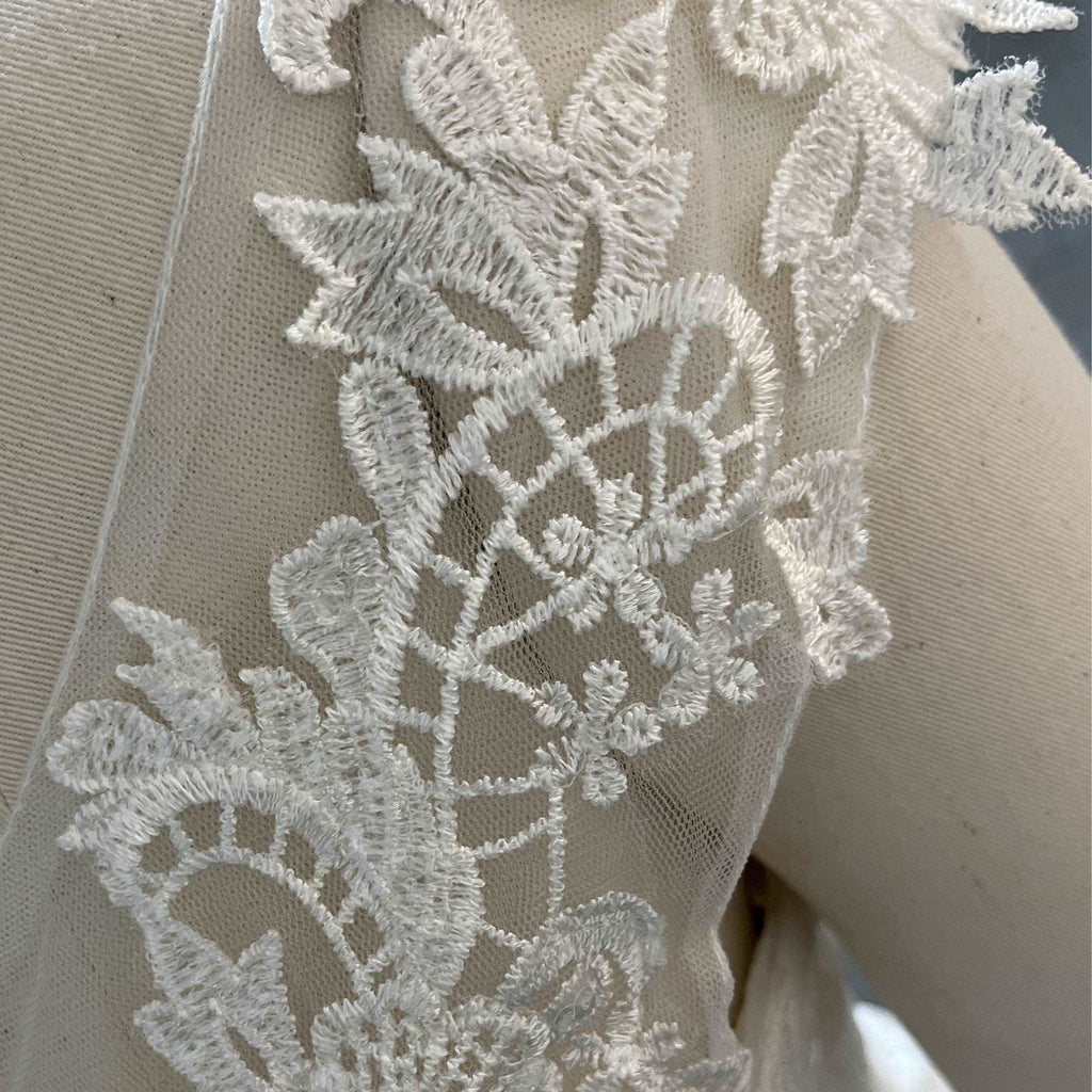 Fashionable minimalist handmade embroidered lace wedding dress.