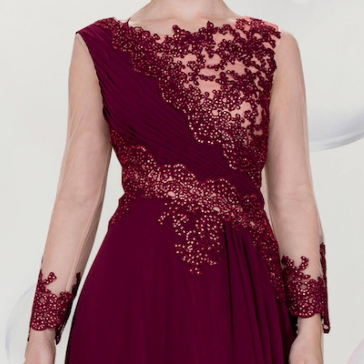 A beautiful gown, off-shoulder, reveals noble air.