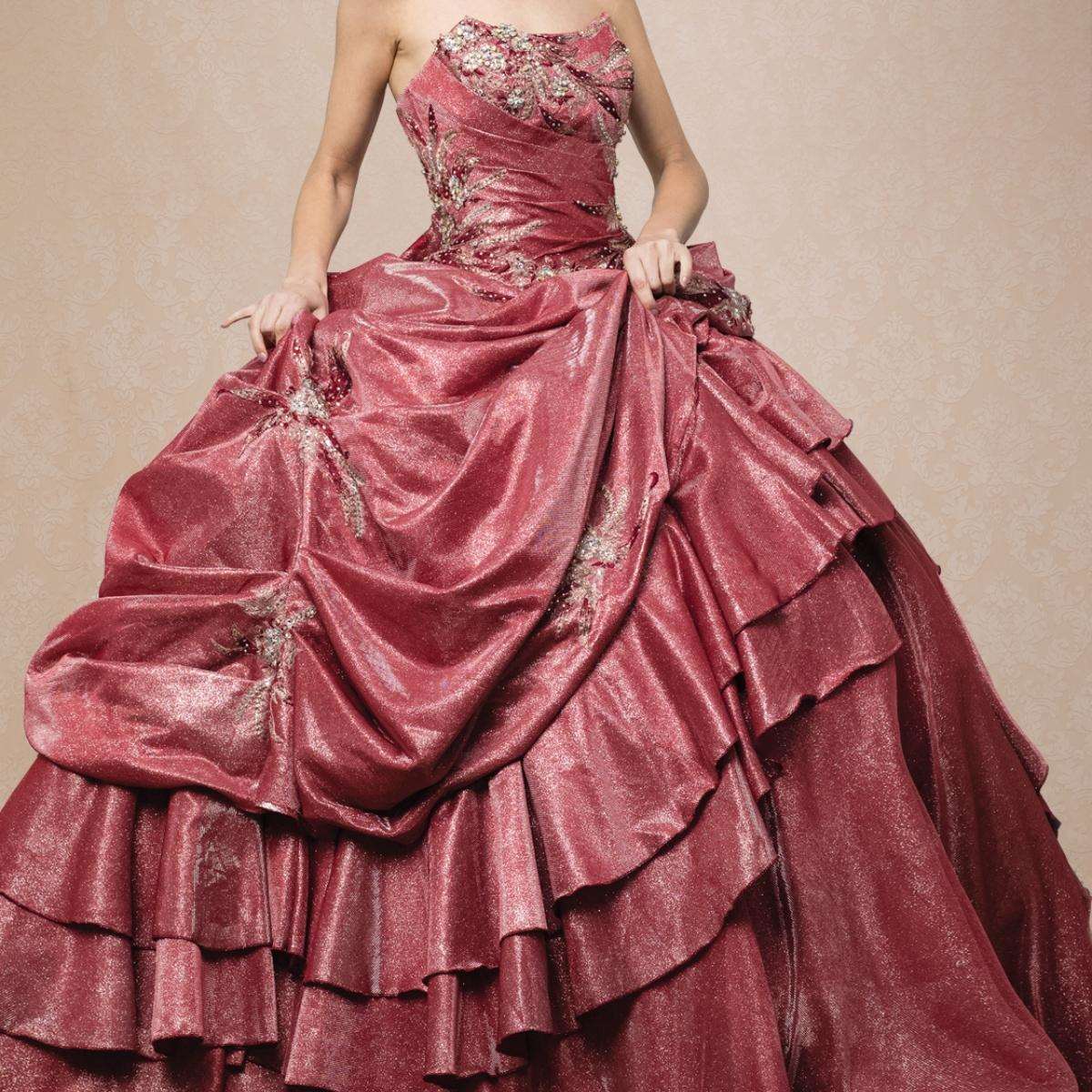 A beautiful gown, off-shoulder, reveals noble air.