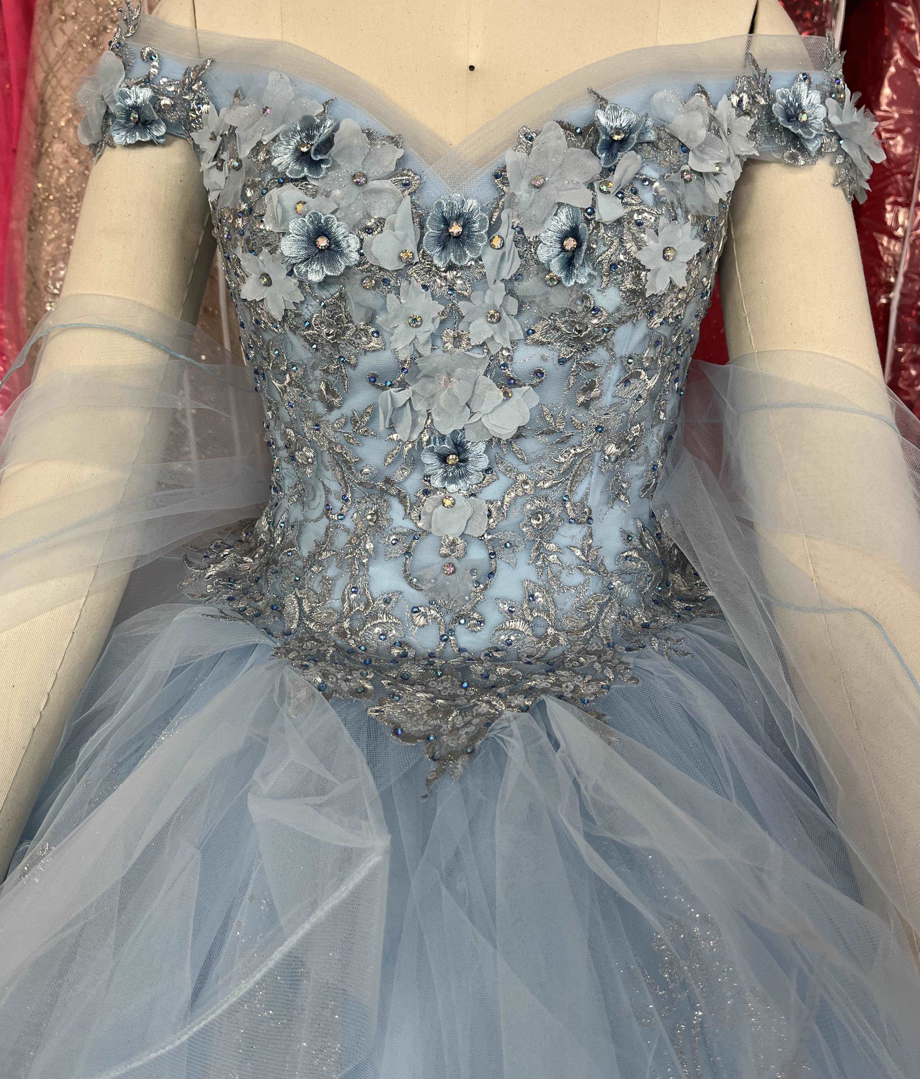 Gowns' elegance, simple hues, enhance life's charm.