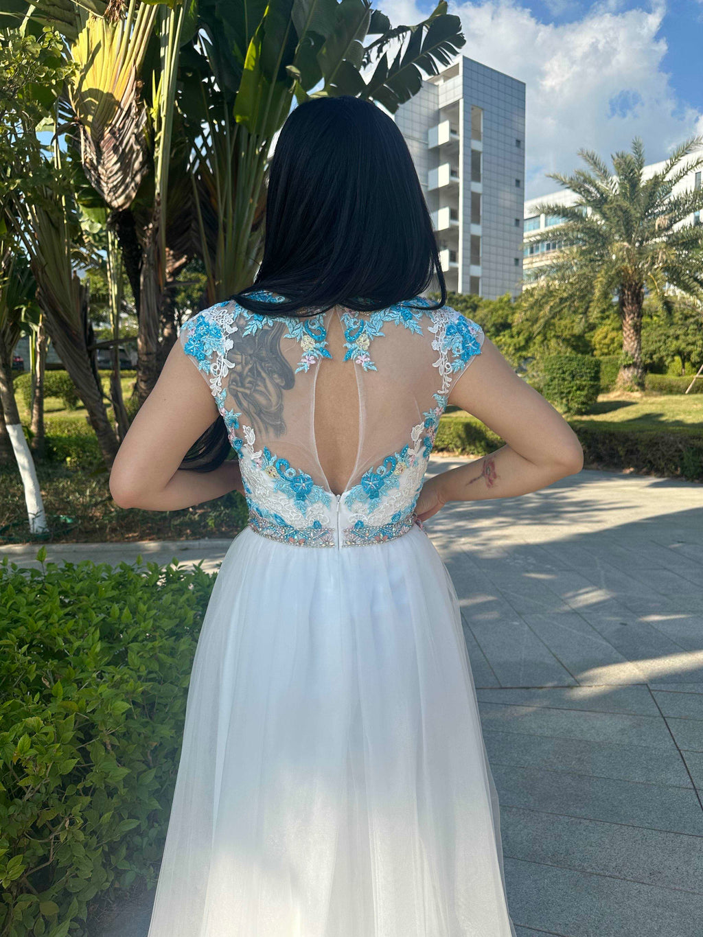 A beautiful gown, off-shoulder, reveals noble air.