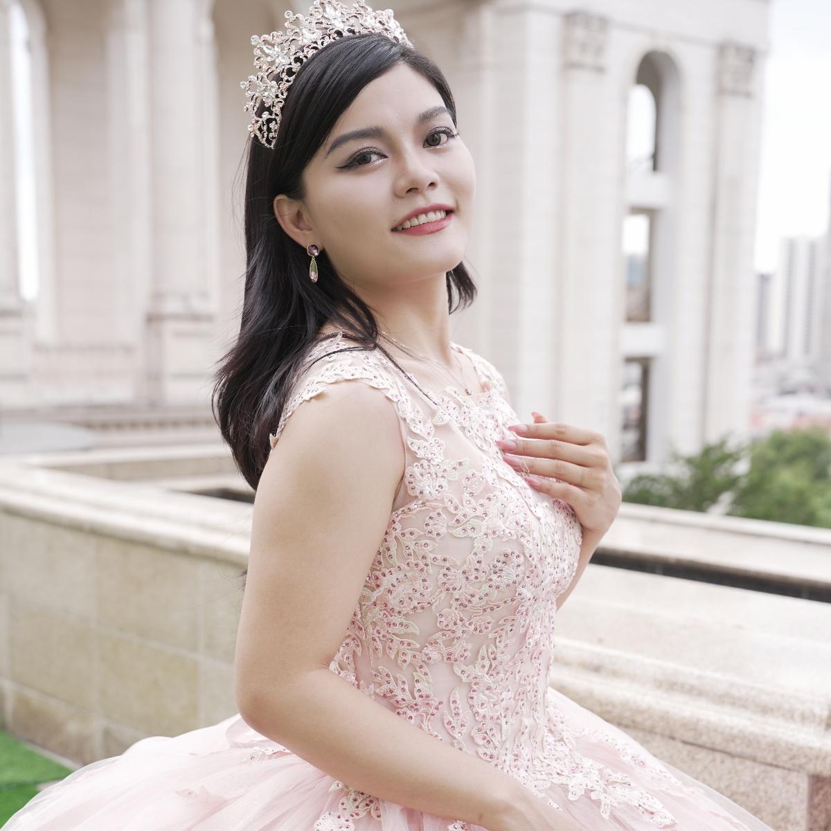 Adults in gowns, flowing skirts, confident display.