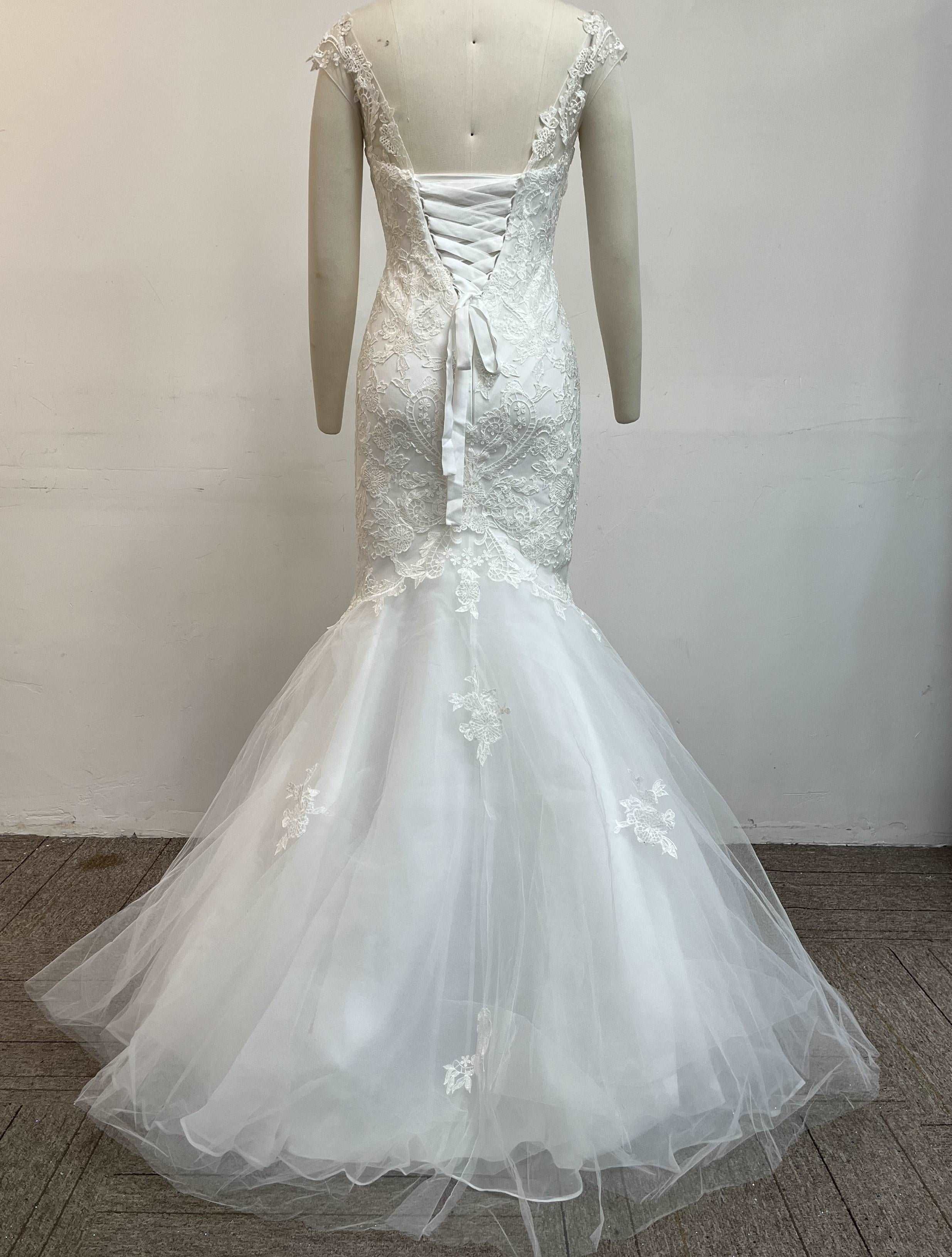 Fashionable minimalist handmade embroidered lace wedding dress.